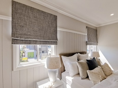 Two Structured grey Roman Blinds for the bedroom windows